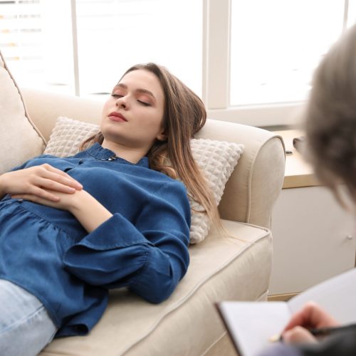 Psychotherapist and patient in office. Hypnotherapy session